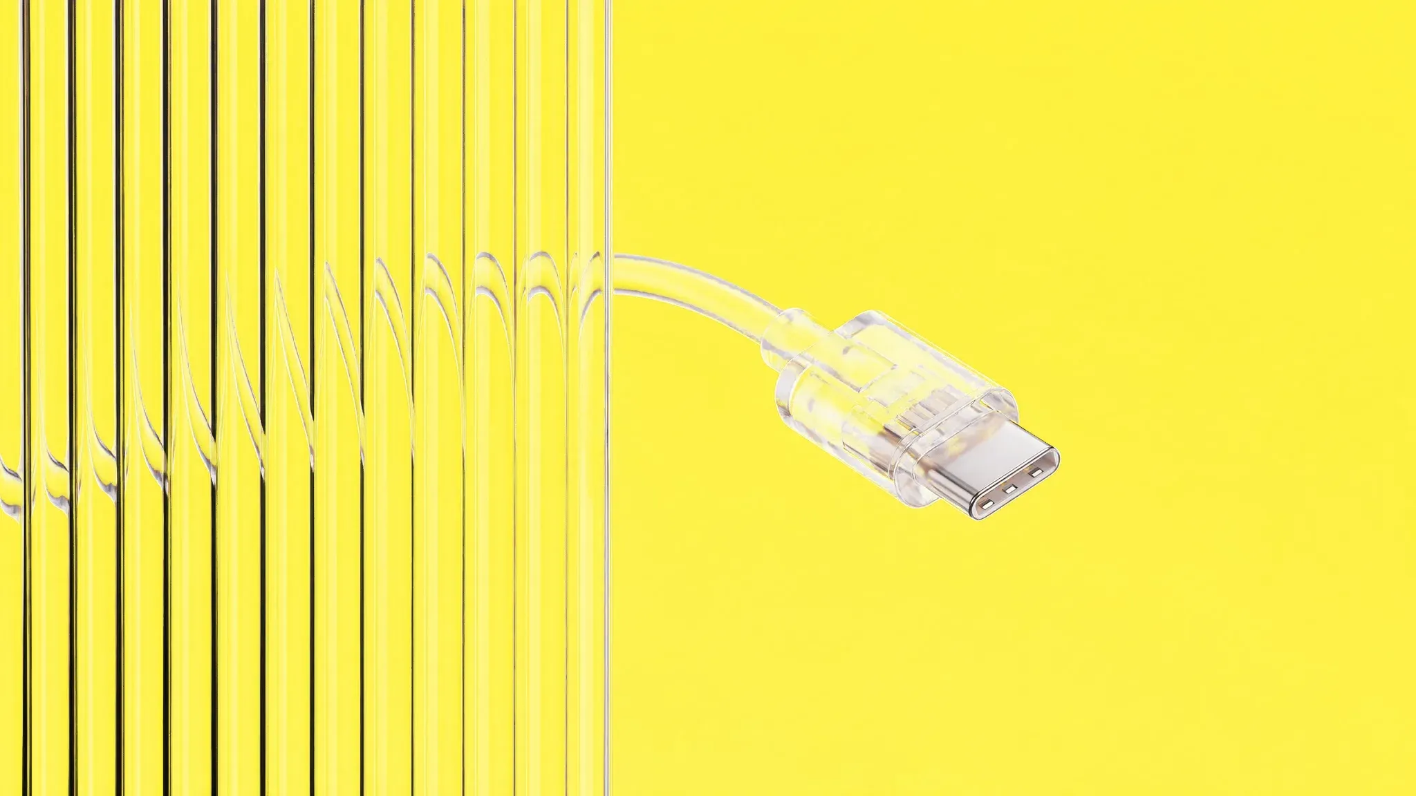 Gläserner USB-C-Stecker mit Kabel vor gelbem Hintergrund, links durch Riffelglas in senkrechte Streifen zerlegt